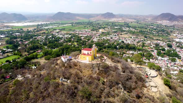 Orbital drone shot of main church of Atlixco Mexico