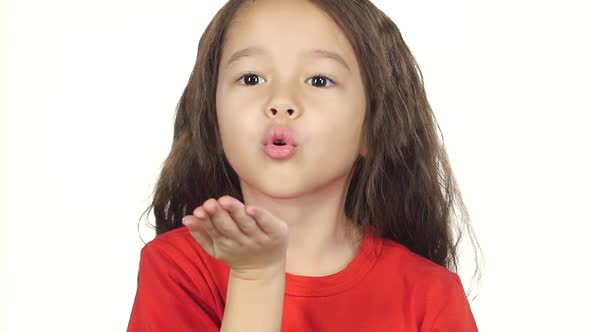 Close-up Attractive Baby Making Air Kiss at White Background. Slow Motion