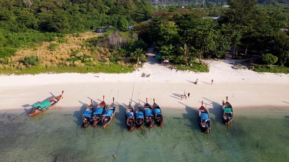 Amazing Overhead Aerial View of Long Tail Boats on a Thailand Beach Shoreline