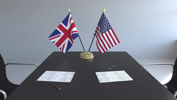 Flags of Great Britain and the United States on the Table