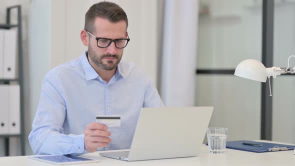 Middle Aged Man Having Online Shopping Failure on Laptop