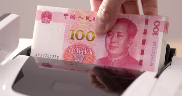 Chinese banknote on money counting machine