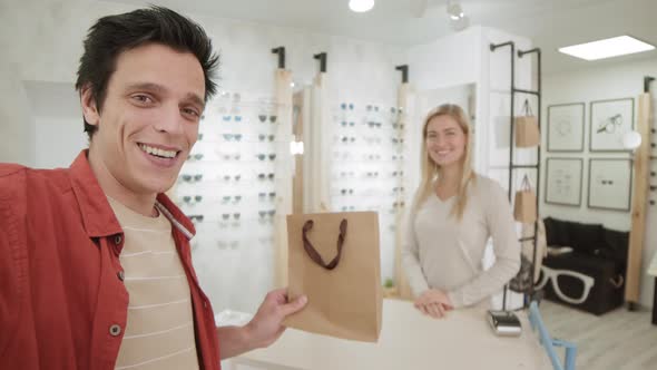 Man Making Selfie after Purchase in Optician Store