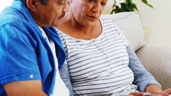 Senior couple doing online shopping on digital tablet 4k