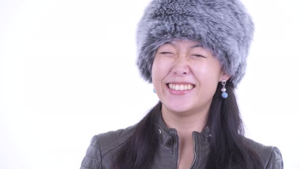 Face of Happy Beautiful Asian Woman Thinking Ready for Winter