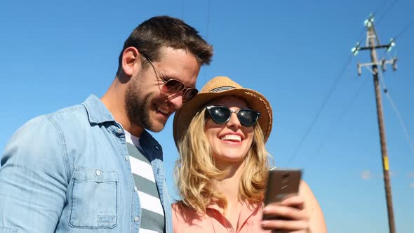 Couple taking selfie with mobile phone 4k