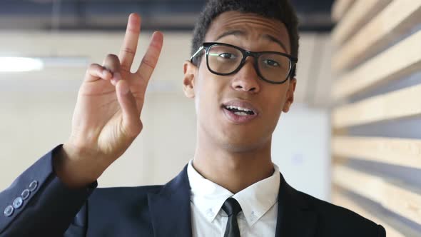 Victory Sign by Successful Black Businessman in Suit, Portrait