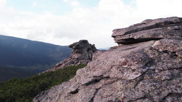 Huge Rocky Formation on the Edge of a Grassy Slope