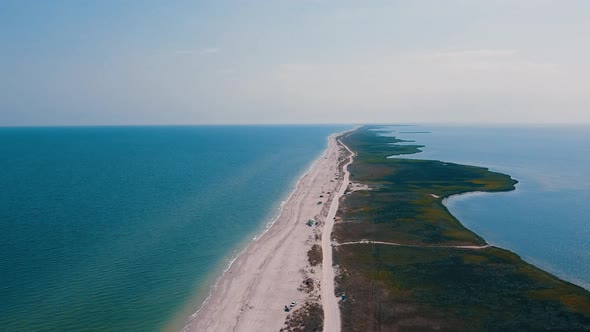 Aerial drone footage of sea beach splited by sand coastline. Scenic panorama sea coastline