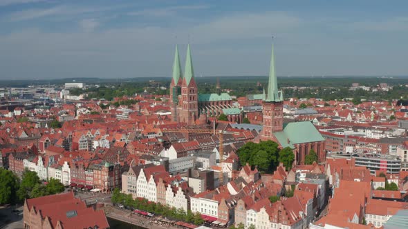 Forwards Fly Towards Historic Brick Buildings in Medieval City Centre