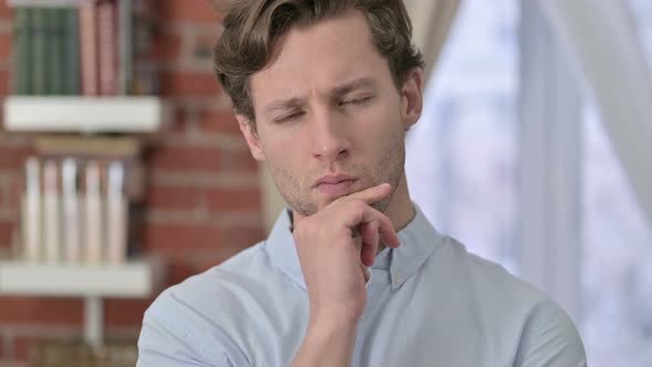 Portrait of Young Man Thinking About New Idea