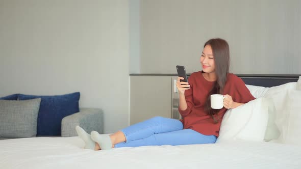 Young asian woman use smart phone