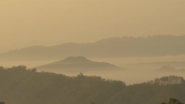 A Small Mountain Covered In Fog.