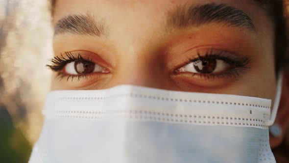 African American Teenage Girl in Medicine Mask During the Covid 19 Close Up