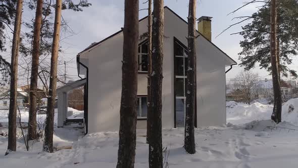 Drone shot of new white modern residential house at winter 04