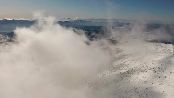 Beautiful Winter Aerial Flight Over Mountain