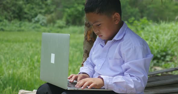 Rural Boy Using Laptop Computer