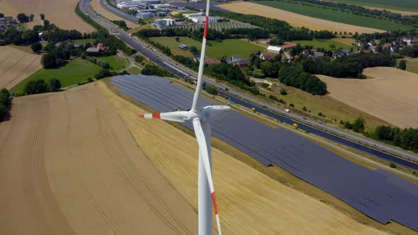 Solar power plant and Windmills aerial view. 