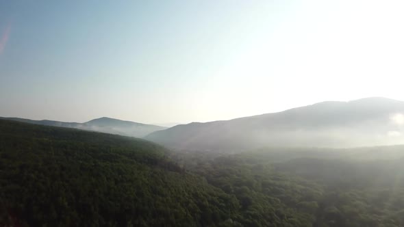 Aerial Landscape View of Caucasus Mountain at Sunny Morning with Fog.