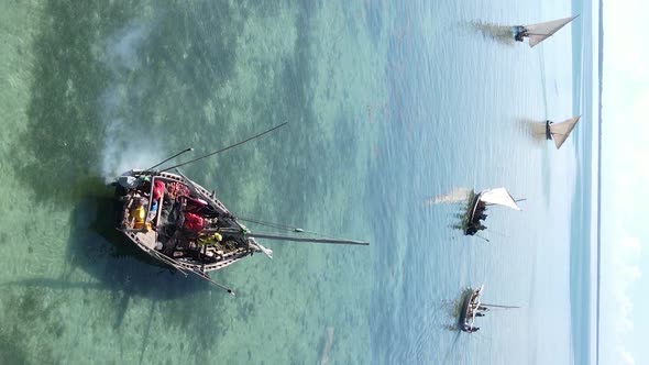 Vertical Video Boats in the Ocean Near the Coast of Zanzibar Tanzania Aerial View