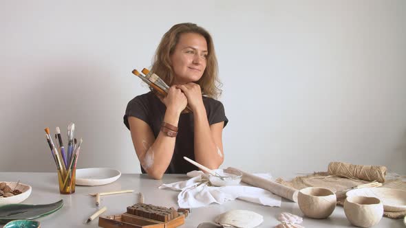 Sculptor Working in a Workshop.