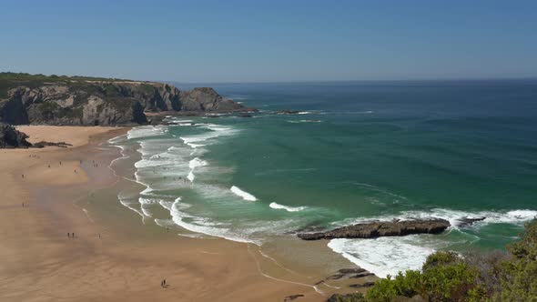 Filming the Beautiful Bay in the Portuguese Town of Odeceixe in the Summer with Tourists on the