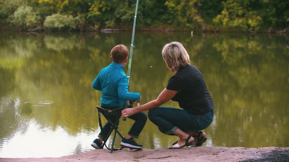 A Little Boy with His Mother on Fishing on Nature