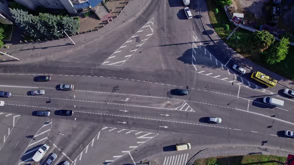 Drone Rises Above the Intersection of the Roads in a Suburb