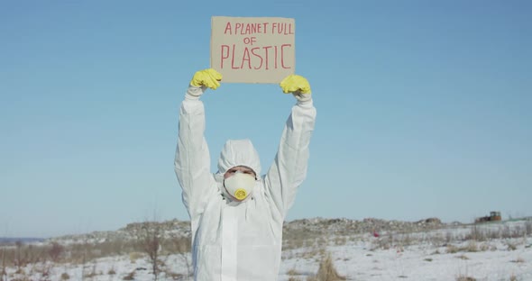 Man Wore in Full Cover Suit Raises Protest Sign "A Planet Full of Plastic"