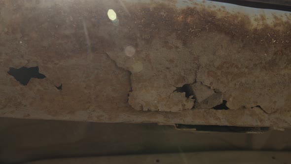 Fragment of a Car Body with Rust