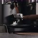 Slow Motion Man Grinding Fresh Coffe in Single Spout Portafilter with Professional Grinder - VideoHive Item for Sale