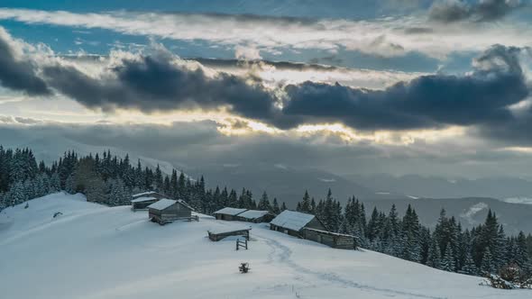 Clouds Move Over the Mountains and the Village of Shepherds in Winter