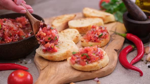 Making a Vegan Healthy Breakfast  Spreading Tomato Salsa on Whole Grain Bread