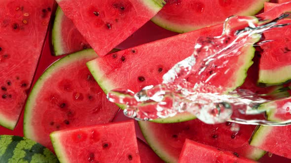 Super Slow Motion Shot of Splashing Water on Fresh Watermelon Slices at 1000Fps