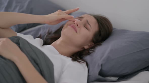Woman Crying While Sleeping in Bed