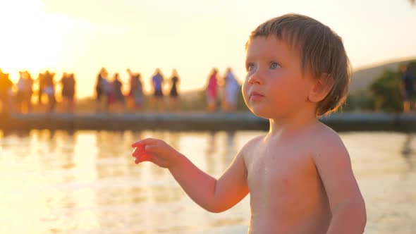 Facial Expression. Happy Childhood. Beautiful Kid Standing on the Seashore. Special Glance. Girl Age