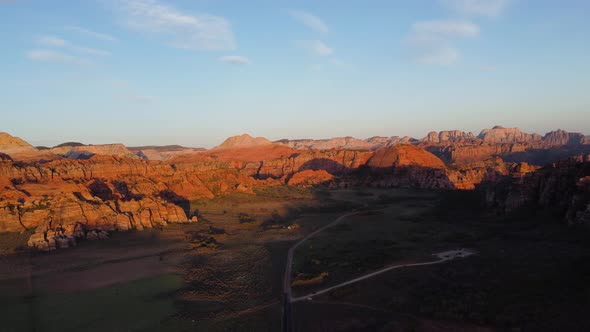 Beautiful aerial landscape view of red rocks in a desert at sunset, Snow Canyon State Park, Utah