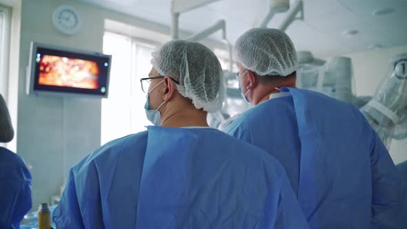 Surgeons Follow the Laparoscopic Surgery on the Screen