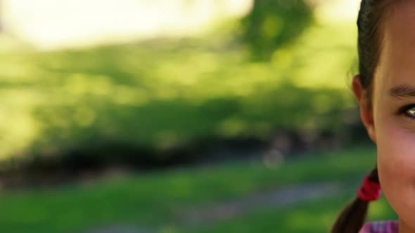 Portrait of a smiling girl in park