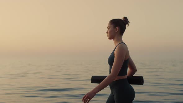 Confident Sportswoman Walking Beach at Sunset Close Up