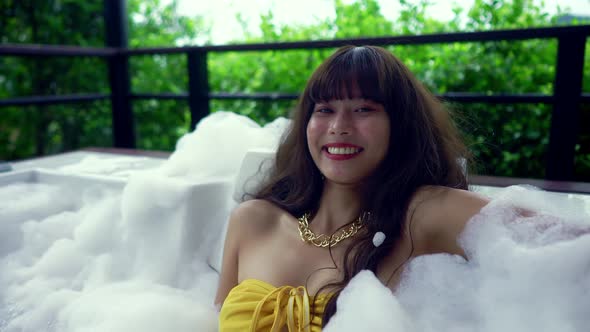 Cute Smiling Asian Girl in Bikini Having Fun in Hot Tube Thailand