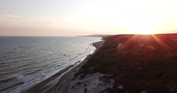 Tropical Beach Video in Sunrise Aerial Bird Eye View of Blue Foaming Ocean Waves Crushing Against