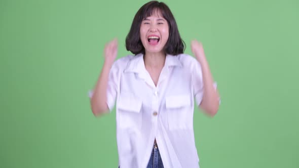 Happy Asian Businesswoman Getting Good News