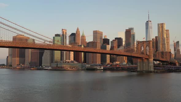 An aerial view over the East River on a beautiful morning. The camera pan left and truck right facin