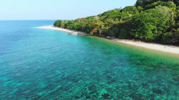 Aerial: flying over tropical island Banda Islands Maluku Indonesia