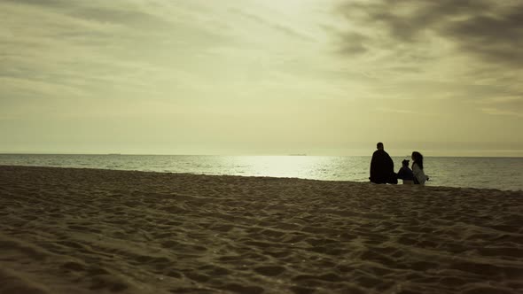 Family Walk Together Beach in Morning