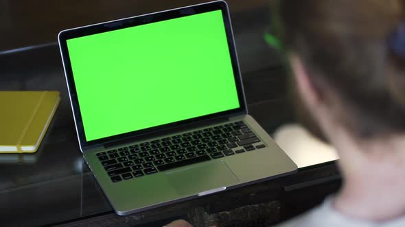 American Businessman Having Online Talk and Using Laptop Sitting at Table in Apartment Room Spbd