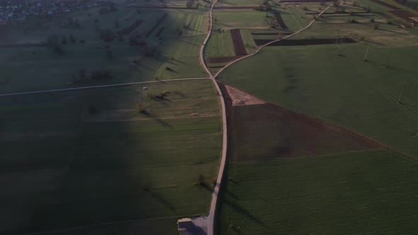 Flying over the countryside on an early spring morning