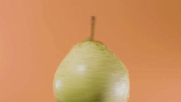 Closeup Shot of Single Passe Crassane Pear Spinning Fast