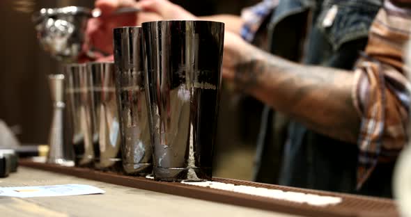 The Bartender Prepares Alcoholic Cocktails